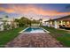 Spacious backyard with a beautiful pool and brick patio at 8014 E Del Tesoro Dr, Scottsdale, AZ 85258