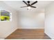 Simple bedroom with hardwood floors and ceiling fan at 8014 E Del Tesoro Dr, Scottsdale, AZ 85258
