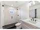 Clean bathroom with white vanity, walk-in shower, and hexagon tile at 8014 E Del Tesoro Dr, Scottsdale, AZ 85258
