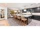 Contemporary kitchen featuring a large island with seating and patterned flooring at 8014 E Del Tesoro Dr, Scottsdale, AZ 85258