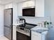 Modern kitchen with stainless steel appliances and marble countertops at 14415 N Boxwood Ln # D, Fountain Hills, AZ 85268