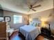 Bright bedroom with hardwood floors and a ceiling fan at 14415 N Boxwood Ln # D, Fountain Hills, AZ 85268