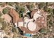 Aerial view of a unique property with terracotta tile roofs, a pool, and landscaped grounds at 9808 E Honey Mesquite Dr, Scottsdale, AZ 85262