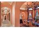 Elegant formal dining room with a large chandelier and seating for eight at 9808 E Honey Mesquite Dr, Scottsdale, AZ 85262
