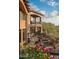 Luxury home with stone exterior, arched entryways, and landscaped grounds at 9808 E Honey Mesquite Dr, Scottsdale, AZ 85262