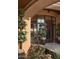 Ornate front entrance with large windows and landscaping at 9808 E Honey Mesquite Dr, Scottsdale, AZ 85262