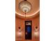 Hallway with unique light fixture and window at 9808 E Honey Mesquite Dr, Scottsdale, AZ 85262