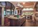 Gourmet kitchen with granite countertops and large island at 9808 E Honey Mesquite Dr, Scottsdale, AZ 85262