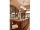 Island kitchen with granite countertops and breakfast bar at 9808 E Honey Mesquite Dr, Scottsdale, AZ 85262