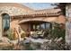Outdoor patio with seating area and pond feature at 9808 E Honey Mesquite Dr, Scottsdale, AZ 85262