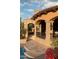 Resort-style pool with a covered patio and lush landscaping at 9808 E Honey Mesquite Dr, Scottsdale, AZ 85262