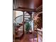 Elegant spiral staircase with wrought iron railing at 9808 E Honey Mesquite Dr, Scottsdale, AZ 85262