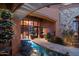 Elegant entryway with a serene water feature and lush landscaping at 9808 E Honey Mesquite Dr, Scottsdale, AZ 85262