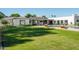 Spacious backyard with lush lawn and a luxurious pool at 5815 N Kiva Ln, Paradise Valley, AZ 85253