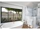 Modern bathroom featuring a freestanding tub and a walk-in shower at 5815 N Kiva Ln, Paradise Valley, AZ 85253