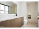 Modern bathroom with marble vanity, glass shower, and contemporary fixtures at 5815 N Kiva Ln, Paradise Valley, AZ 85253