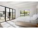 Light and airy bedroom with large windows and access to private patio at 5815 N Kiva Ln, Paradise Valley, AZ 85253