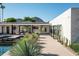 Luxury home exterior with a walkway leading to the pool and patio at 5815 N Kiva Ln, Paradise Valley, AZ 85253