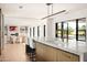 Open kitchen with marble island and views of the backyard at 5815 N Kiva Ln, Paradise Valley, AZ 85253