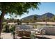 Relaxing patio area with seating and a view of Camelback Mountain at 5815 N Kiva Ln, Paradise Valley, AZ 85253