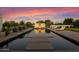 Relaxing pool area with fire pit and lounge chairs at sunset at 5815 N Kiva Ln, Paradise Valley, AZ 85253