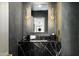 Elegant powder room with dark marble vanity and gold accents at 5815 N Kiva Ln, Paradise Valley, AZ 85253