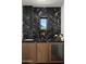 Elegant wet bar with black marble herringbone tile at 5815 N Kiva Ln, Paradise Valley, AZ 85253