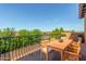 Private balcony with wooden table and chairs, offering scenic views at 8442 S 22Nd St, Phoenix, AZ 85042