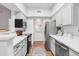 Bright kitchen with white cabinets, stainless steel appliances, and tile floor at 10401 N Saguaro Blvd # 224, Fountain Hills, AZ 85268