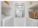 Well-lit laundry room with washer, dryer, and shelving at 10401 N Saguaro Blvd # 224, Fountain Hills, AZ 85268