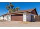 Single story home with a large driveway and gated entrance at 6420 E Jensen St, Mesa, AZ 85205