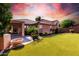 Large backyard with a grassy area and a fire pit at 2754 W Tanner Ranch Rd, San Tan Valley, AZ 85144