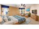 Spacious bedroom with ceiling fan, wicker furniture, and large windows at 2754 W Tanner Ranch Rd, San Tan Valley, AZ 85144
