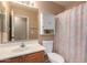 Clean bathroom with single vanity, shower/tub combo, and linen cabinet at 2754 W Tanner Ranch Rd, San Tan Valley, AZ 85144