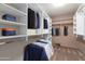 Large walk-in closet with ample shelving and hanging space at 2754 W Tanner Ranch Rd, San Tan Valley, AZ 85144