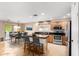 Modern kitchen with island, stainless steel appliances, and dark countertops at 2754 W Tanner Ranch Rd, San Tan Valley, AZ 85144