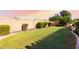 Landscaped backyard featuring a lush lawn and a curved pathway at 2754 W Tanner Ranch Rd, San Tan Valley, AZ 85144