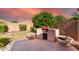 Outdoor kitchen area with a built-in grill and ample seating at 2754 W Tanner Ranch Rd, San Tan Valley, AZ 85144