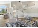 Elegant living room with high ceilings, a grand staircase, and ample natural light at 8757 E Lariat Ln, Scottsdale, AZ 85255
