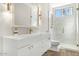 Modern bathroom with white vanity, marble shower, and gold accents at 8757 E Lariat Ln, Scottsdale, AZ 85255