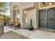 Inviting front entry with decorative iron doors and a tranquil sitting area at 8757 E Lariat Ln, Scottsdale, AZ 85255