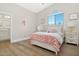 Bright bedroom with floral bedding and en-suite bathroom access at 8757 E Lariat Ln, Scottsdale, AZ 85255