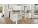 Bright kitchen with white cabinets, large island, and stainless steel appliances at 8757 E Lariat Ln, Scottsdale, AZ 85255