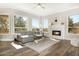 Bright living room with a fireplace and ample natural light at 8757 E Lariat Ln, Scottsdale, AZ 85255