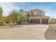 Two story house with attached garage and desert landscaping at 8757 E Lariat Ln, Scottsdale, AZ 85255