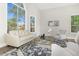 Light and airy living room with a large window and stylish furniture at 8757 E Lariat Ln, Scottsdale, AZ 85255