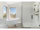 Spa-like bathroom with a large walk-in shower and a freestanding bathtub at 8757 E Lariat Ln, Scottsdale, AZ 85255