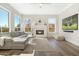 Relaxing living room with a cozy fireplace and large windows at 8757 E Lariat Ln, Scottsdale, AZ 85255
