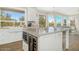 Spacious kitchen with a large island, white cabinets, and a farmhouse sink at 8757 E Lariat Ln, Scottsdale, AZ 85255