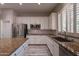 Galley kitchen with stainless steel appliances and granite countertops at 1912 E Gemini Pl, Chandler, AZ 85249